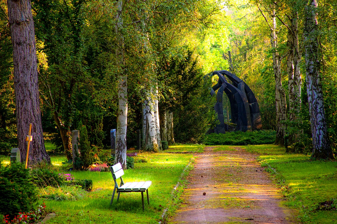 Peaceful cemetery with headstones and trees, symbolizing planning for burial insurance for seniors.