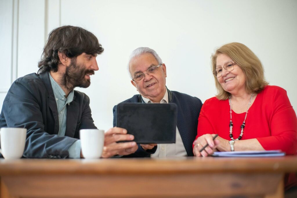 Independent Medicare agent in Galesburg, Michigan helping a senior couple review health plan options over coffee.