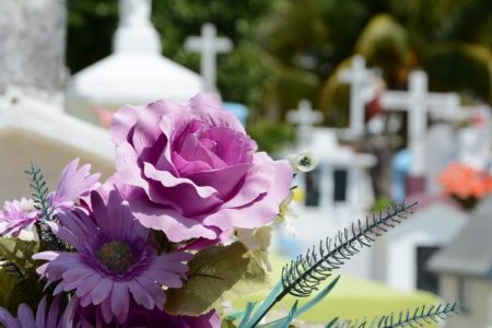 Cemetery headstones and peaceful landscape symbolizing final expense insurance coverage for funeral and burial costs."